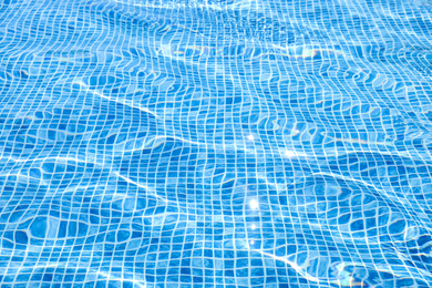 Photo of Swimming pool with clean blue water as background. Summer vacation