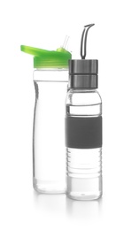 Photo of Different water bottles for sports on white background