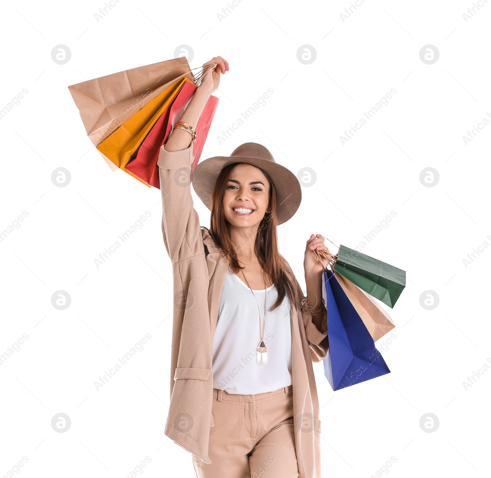 Photo of Young woman with shopping bags on white background