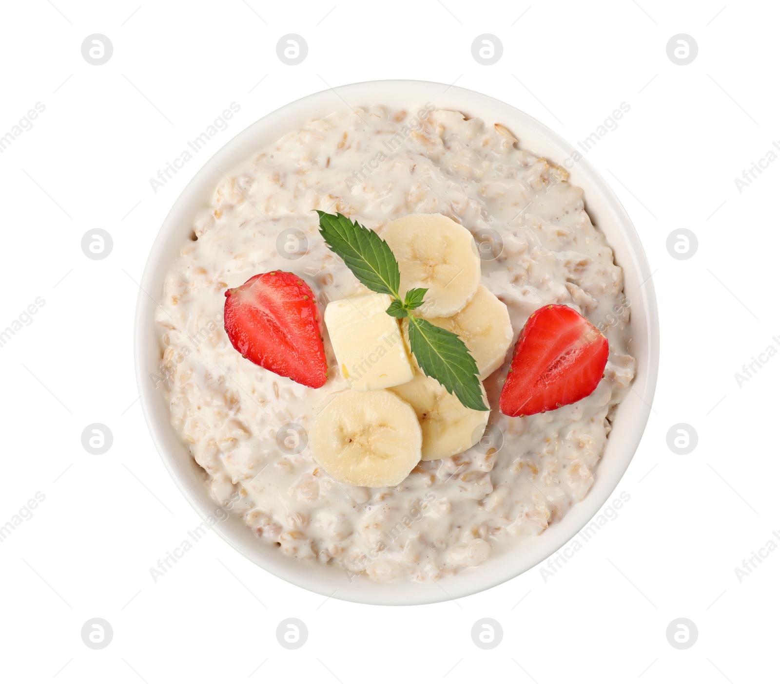 Photo of Tasty boiled oatmeal with banana and strawberry in bowl isolated on white, top view