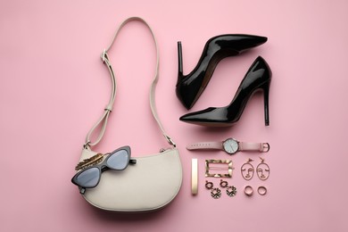 Stylish woman's bag, shoes and accessories on beige background, flat lay