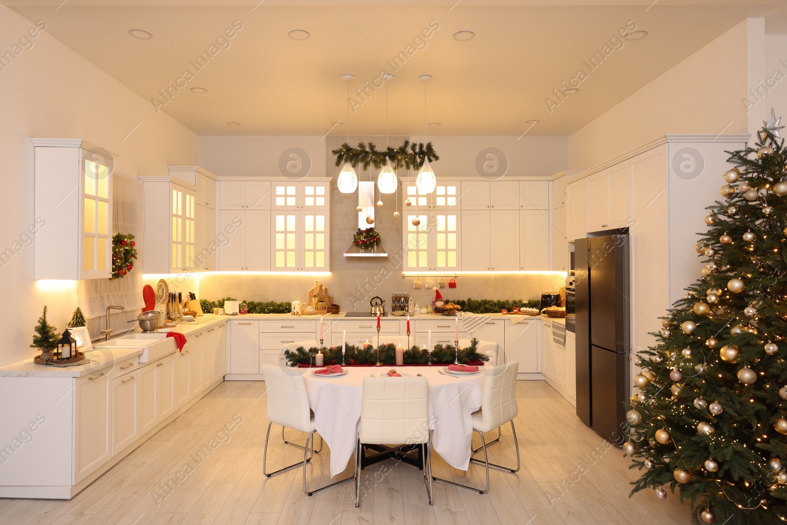 Photo of Cozy spacious kitchen decorated for Christmas. Interior design