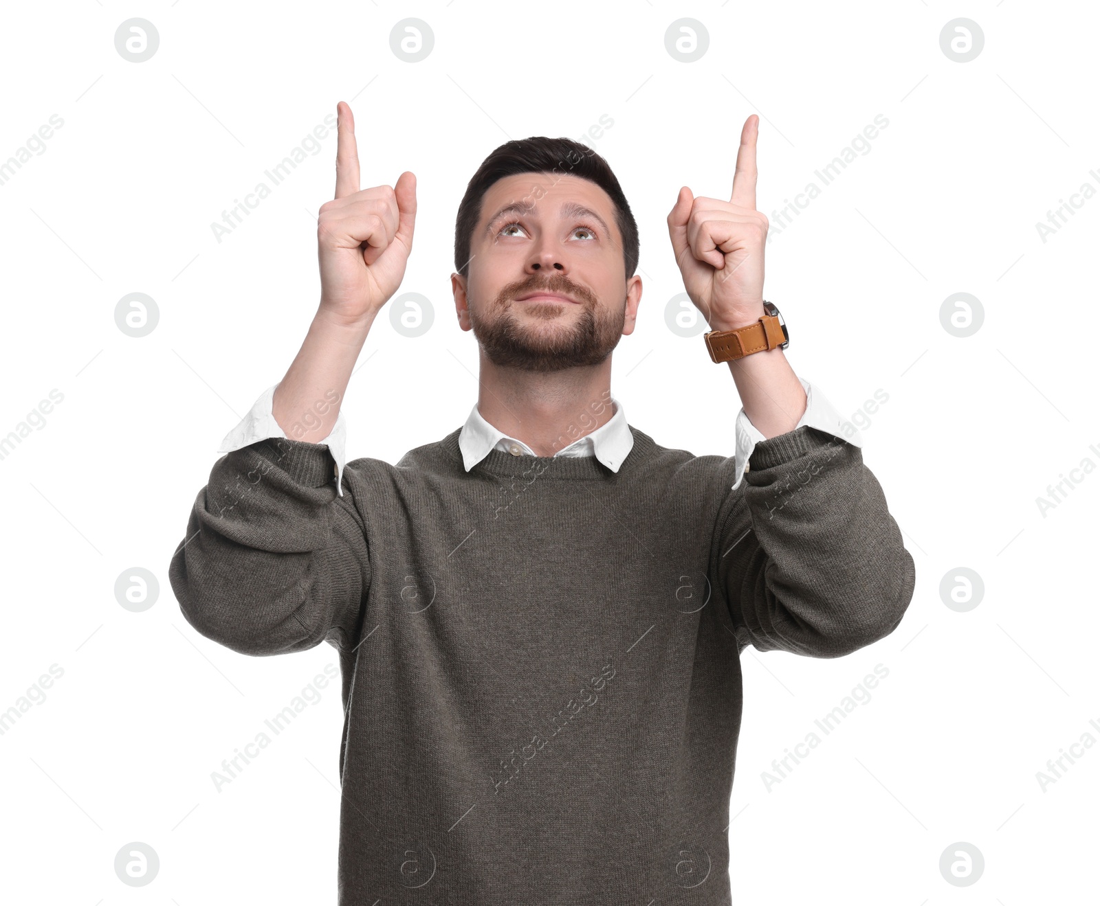 Photo of Portrait of handsome bearded businessman pointing at something on white background