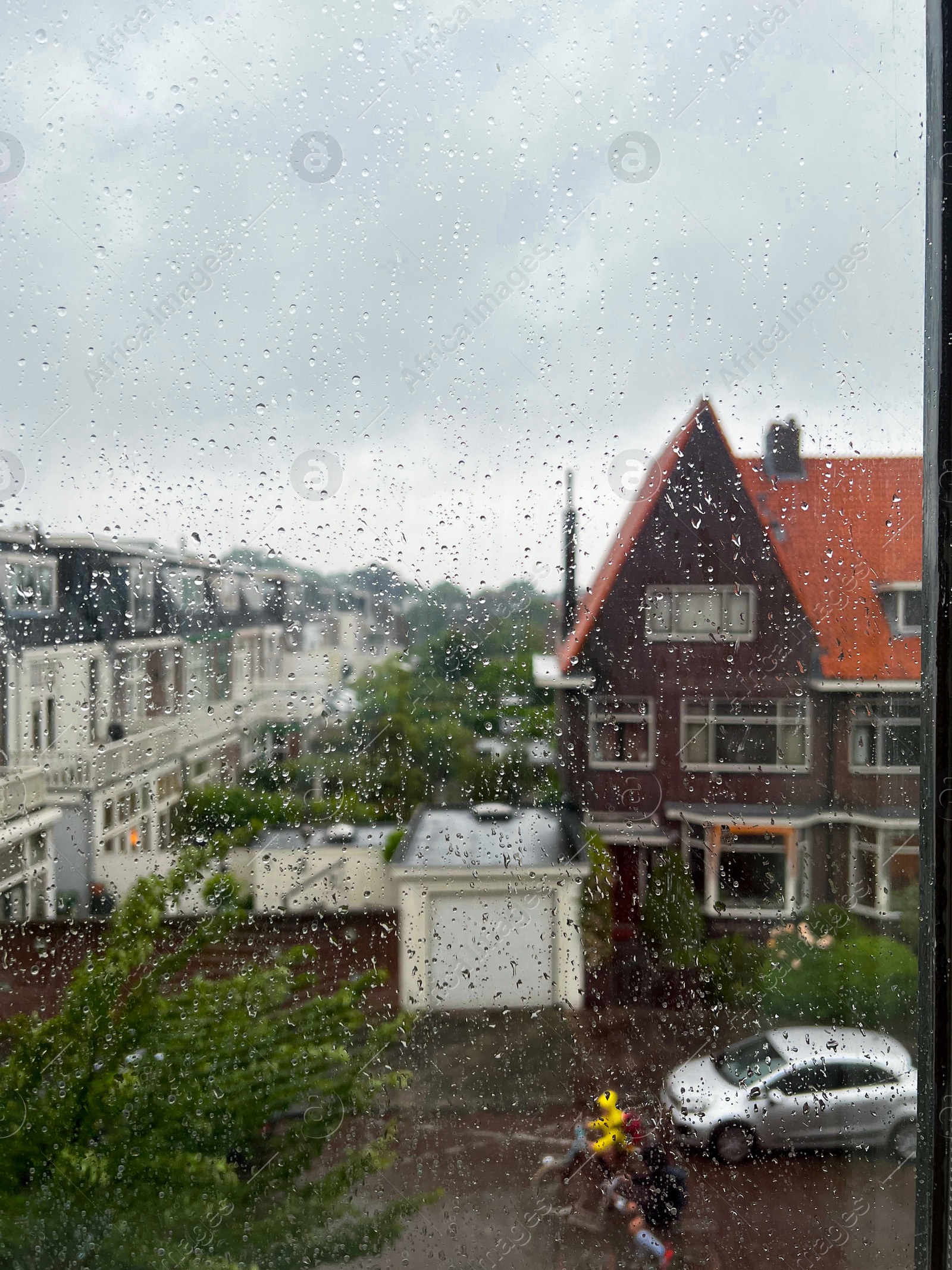 Photo of Window glass with water drops, view from inside. Rainy weather