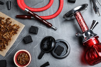 Photo of Flat lay composition with parts of hookah on grey table