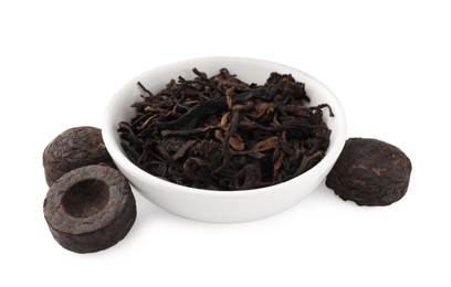 Cake shaped traditional Chinese pu-erh tea and leaves isolated on white