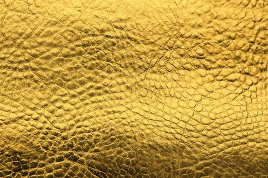 Image of Golden textured surface as background, closeup view