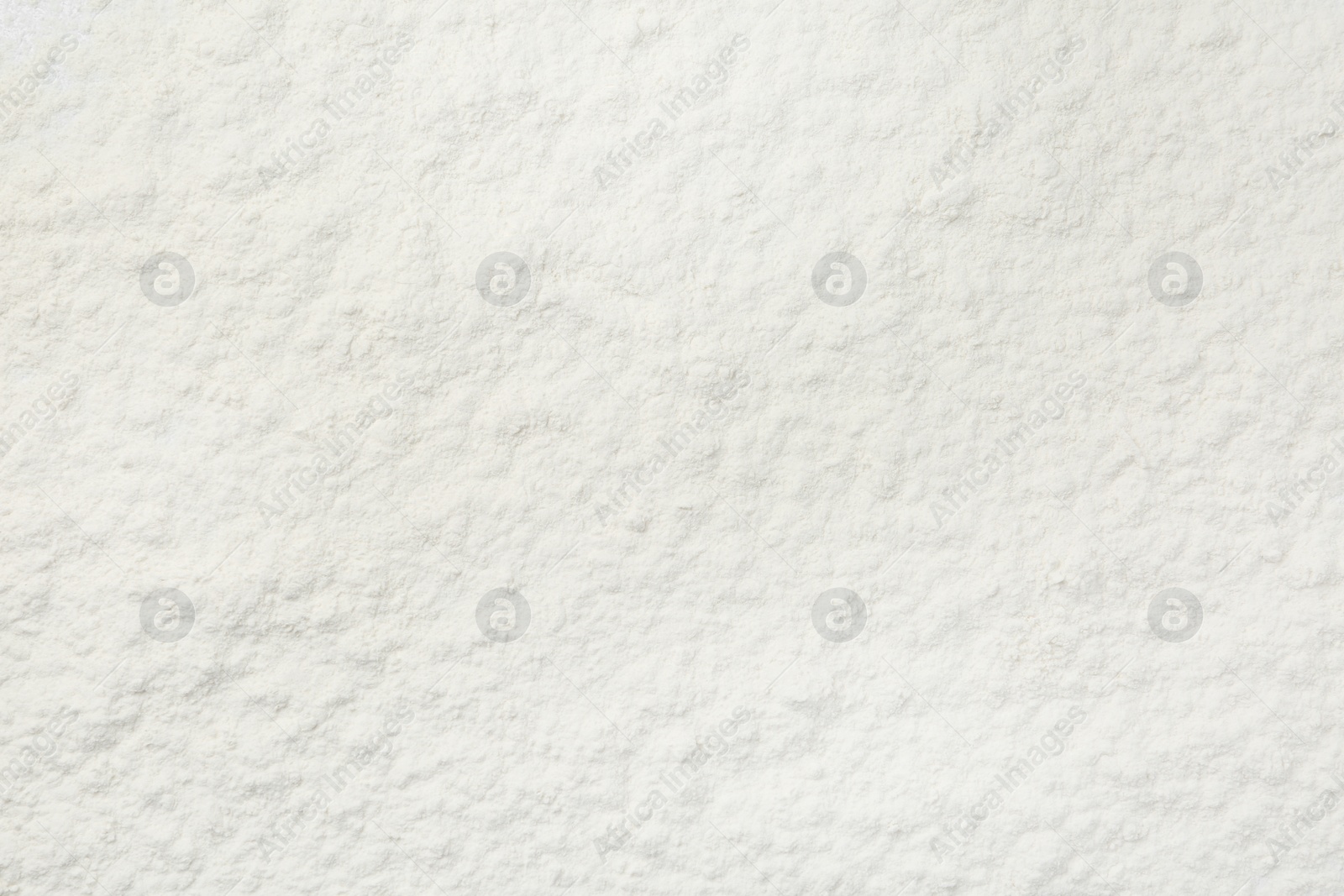 Photo of Pile of organic flour as background, top view