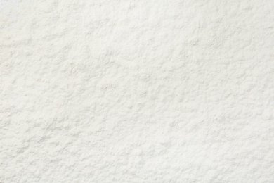 Photo of Pile of organic flour as background, top view