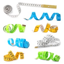 Set with different measuring tapes on white background