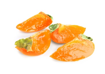 Photo of Slices of delicious persimmon isolated on white