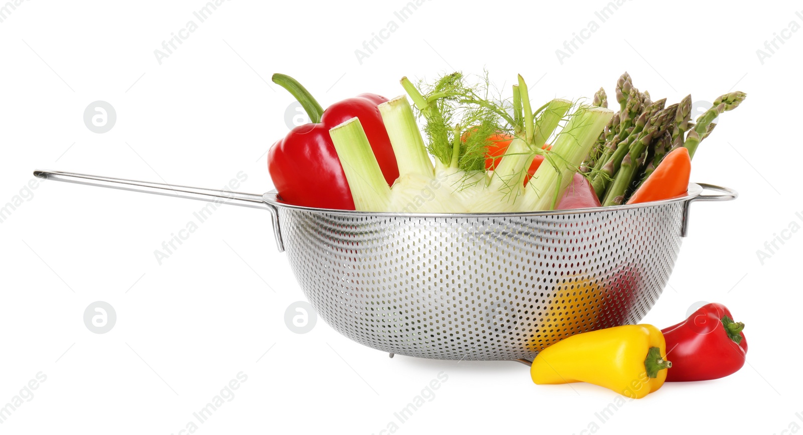 Photo of Metal colander with different vegetables isolated on white