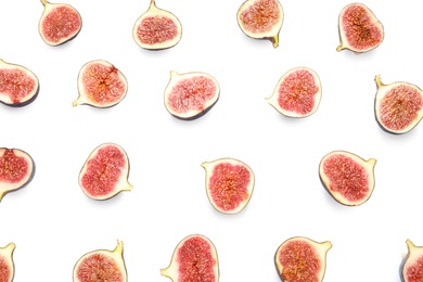 Cut ripe figs on white background, top view