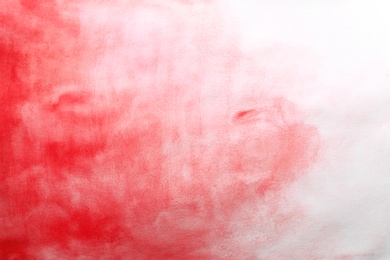 Photo of Colorful paint on white paper. Abstract background
