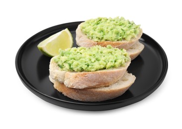 Delicious sandwiches with guacamole and lime wedge on white background