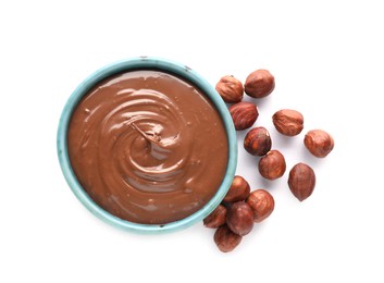 Bowl with tasty chocolate paste and nuts isolated on white, top view