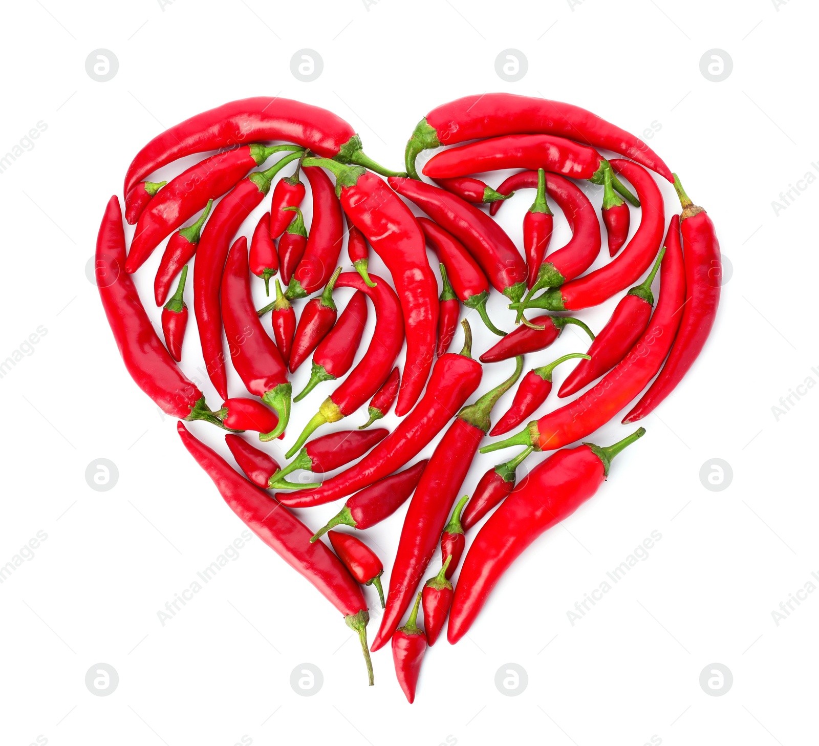 Photo of Heart made of red chili peppers on white background