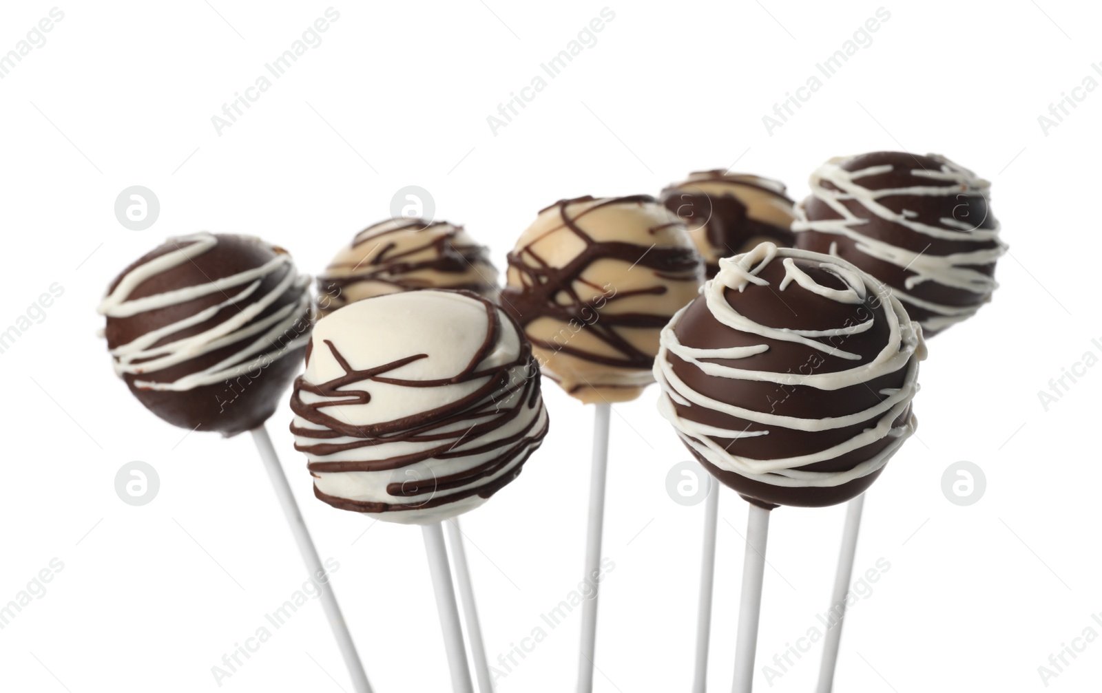 Photo of Tasty cake pops decorated with chocolate isolated on white