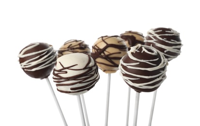 Tasty cake pops decorated with chocolate isolated on white