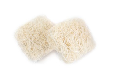 Photo of Bricks of dried rice noodles on white background, top view