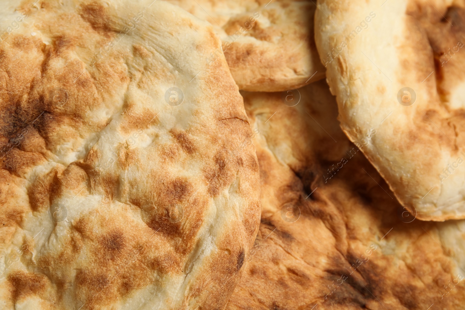 Photo of Delicious fresh pita bread as background, closeup