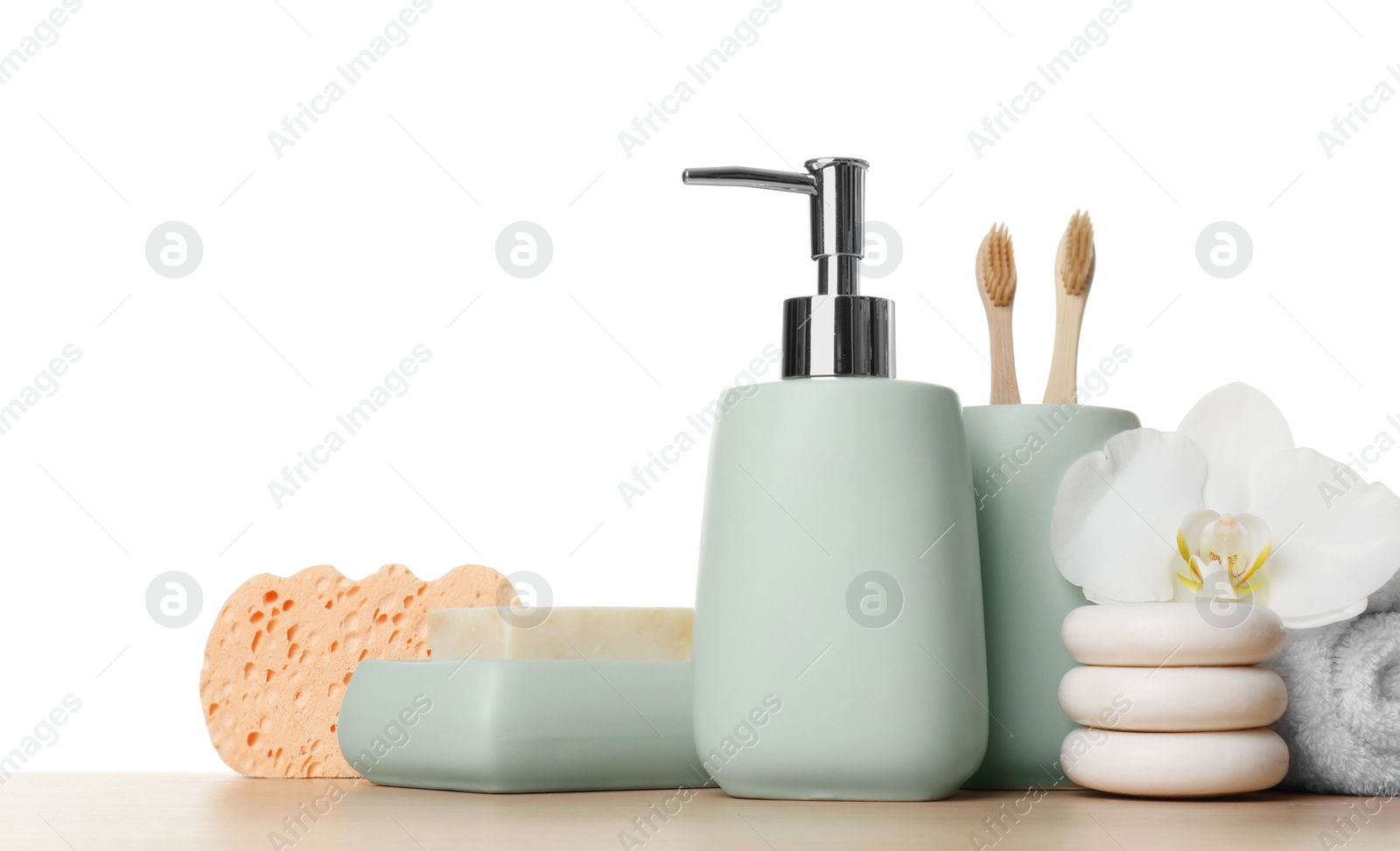 Photo of Bath accessories. Different personal care products and flower on wooden table against white background. Space for text