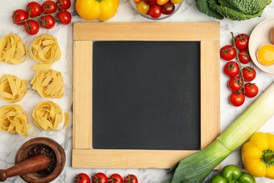 Photo of Chalkboard surrounded by different ingredients on white marble table, flat lay with space for text. Cooking classes