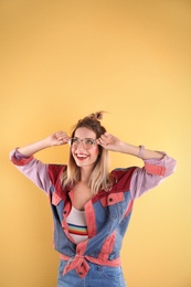 Beautiful young woman posing on color background. Summer fashion