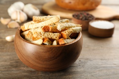Photo of Delicious hard chucks in bowl on wooden table