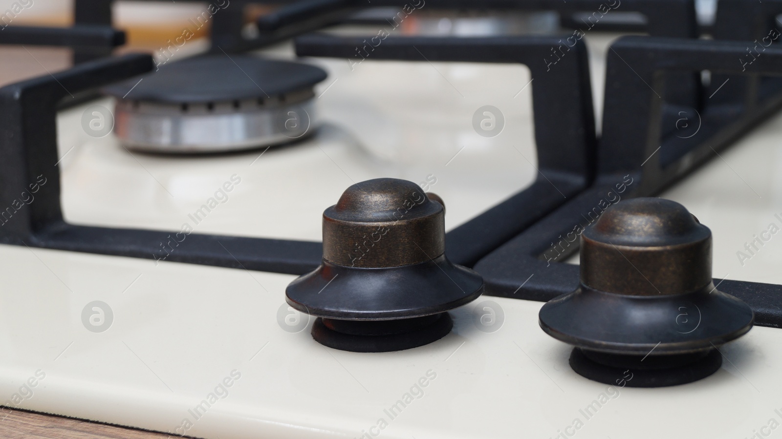 Photo of Modern gas cooktop in kitchen, closeup. Cooking appliance