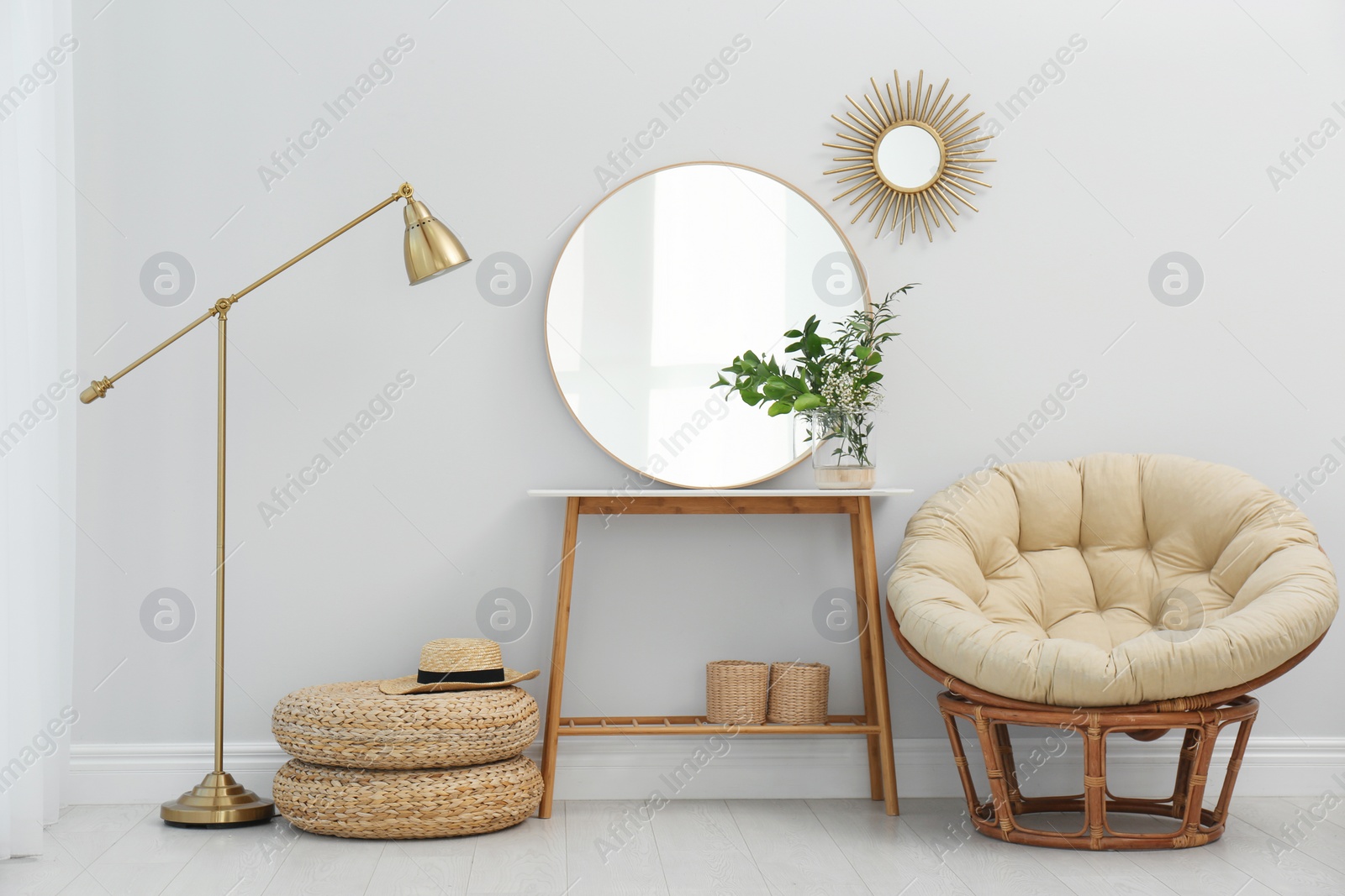 Photo of Stylish round mirror near white wall in room