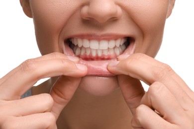 Photo of Woman showing her clean teeth on white background, closeup