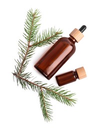 Bottles of pine essential oil on white background, top view