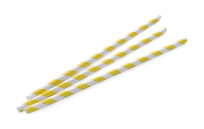 Photo of Striped paper cocktail straws on white background, top view