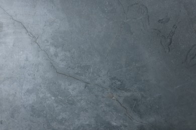 Photo of Beautiful grey stone surface as background, closeup