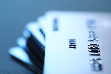 Many credit card on blurred background, macro view