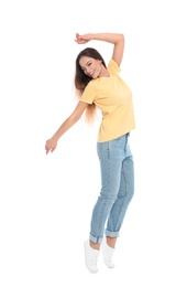 Happy young woman in casual outfit jumping on white background