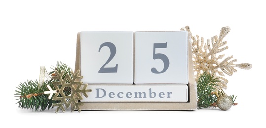 Wooden block calendar and decor on white background. Christmas celebration