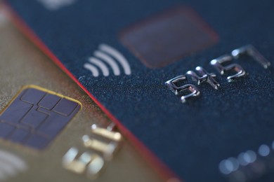 Photo of Two plastic credit cards as background, macro view