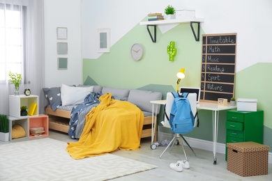 Photo of Modern child room interior with comfortable bed