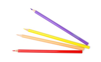 Colorful wooden pencils on white background, top view