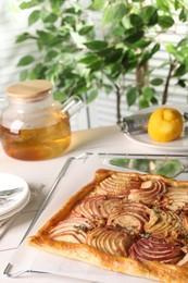 Photo of Freshly baked apple pie served on white table