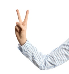 Photo of Young woman showing victory gesture on white background