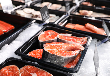 Steaks of fresh fish on ice in supermarket