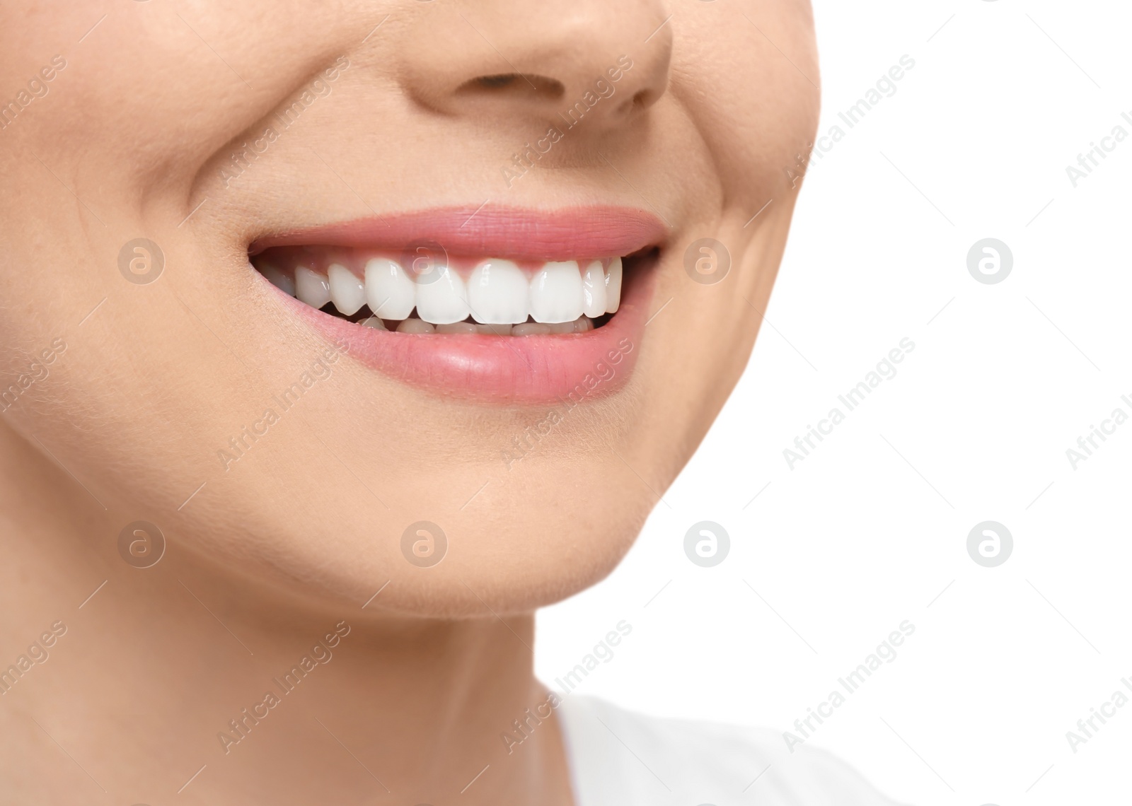 Photo of Young woman with beautiful smile on white background, closeup. Teeth whitening