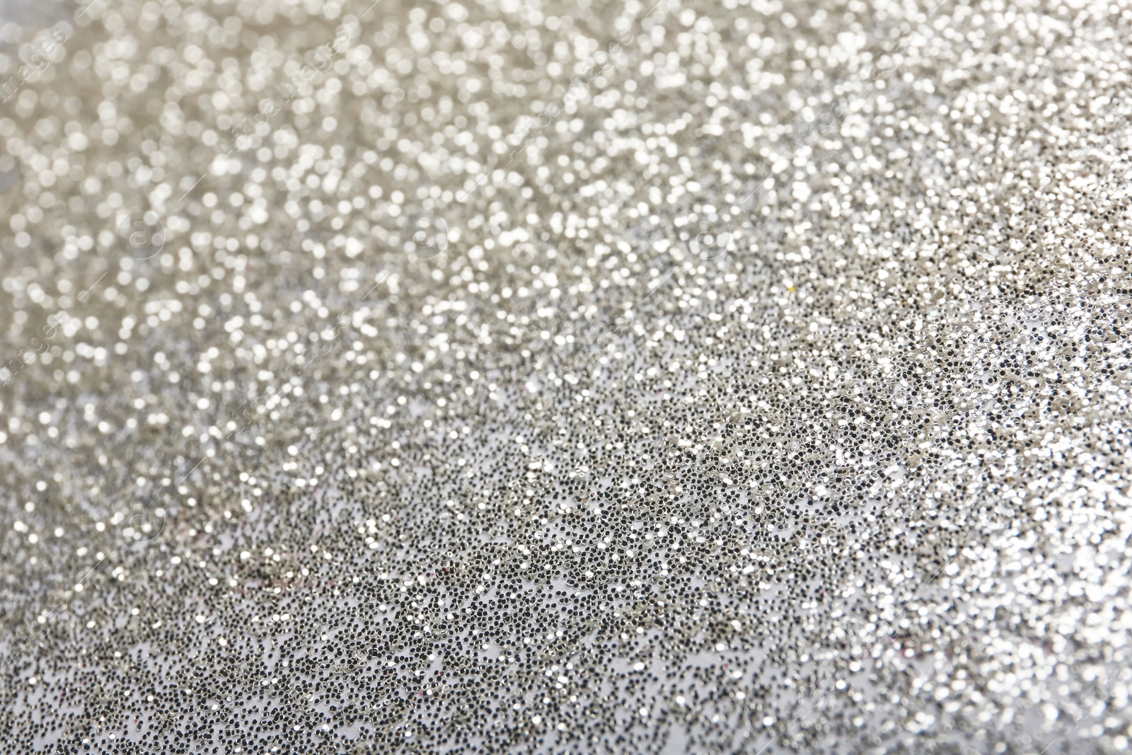 Photo of Closeup view of sparkling silver glitter background