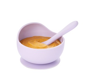 Photo of Plastic dishware with healthy baby food on white background