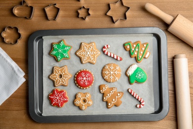 Photo of Tasty colorful Christmas cookies on table, top view