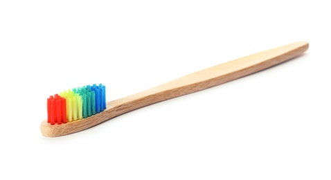 Photo of Toothbrush made of bamboo on white background