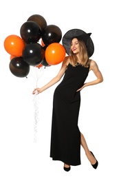 Beautiful woman wearing witch costume with balloons for Halloween party on white background